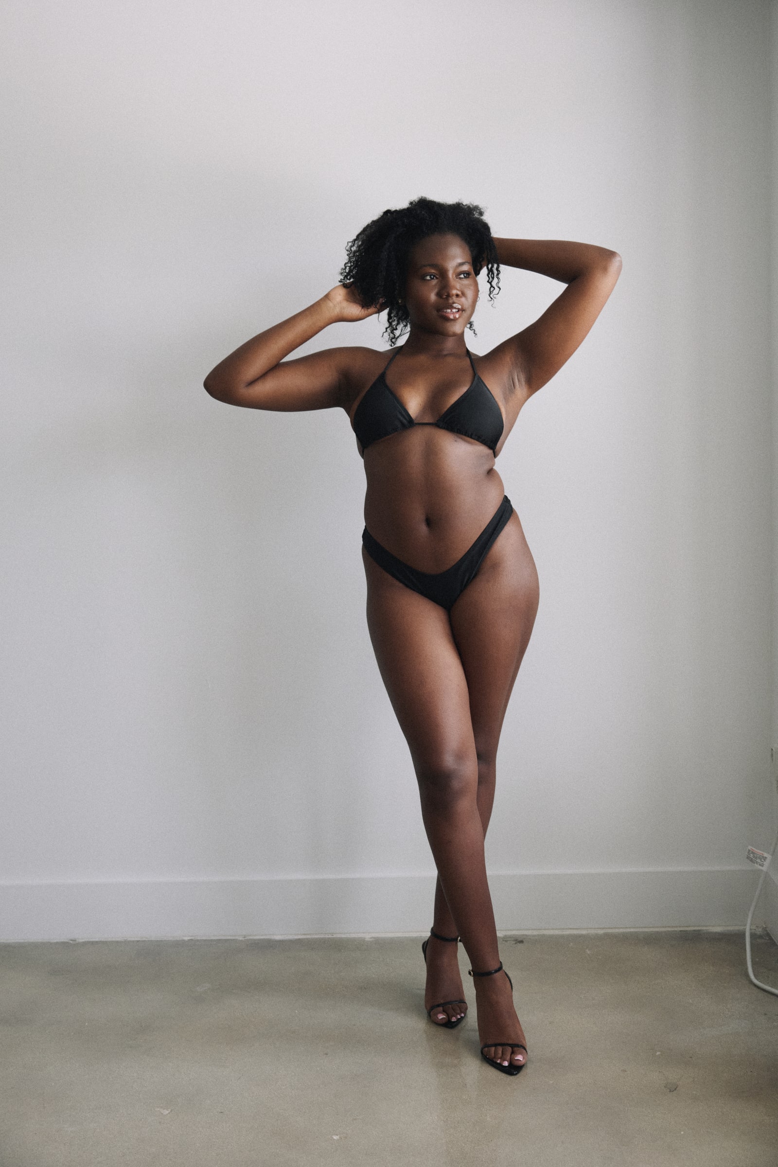 Full-body modeling portrait of Treicy Saint Jean